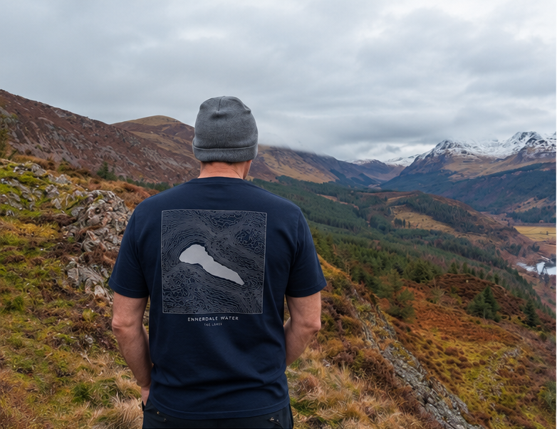 Ennerdale Water navy organic cotton T-shirt with silver contour print, worn on a Lake District fellside